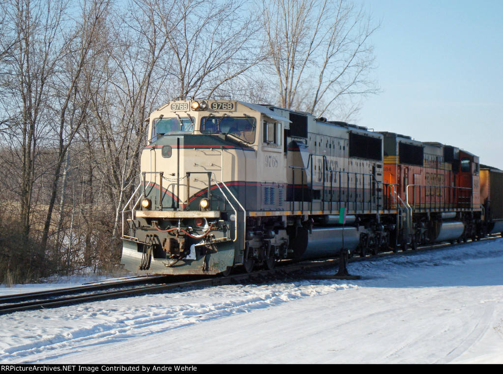 BNSF 9768 leads 882 past the north wye switch for the industrial lead